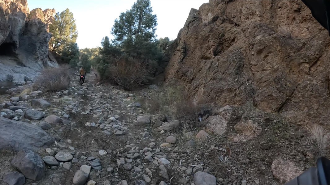 Rocky canyon with rider ahead
